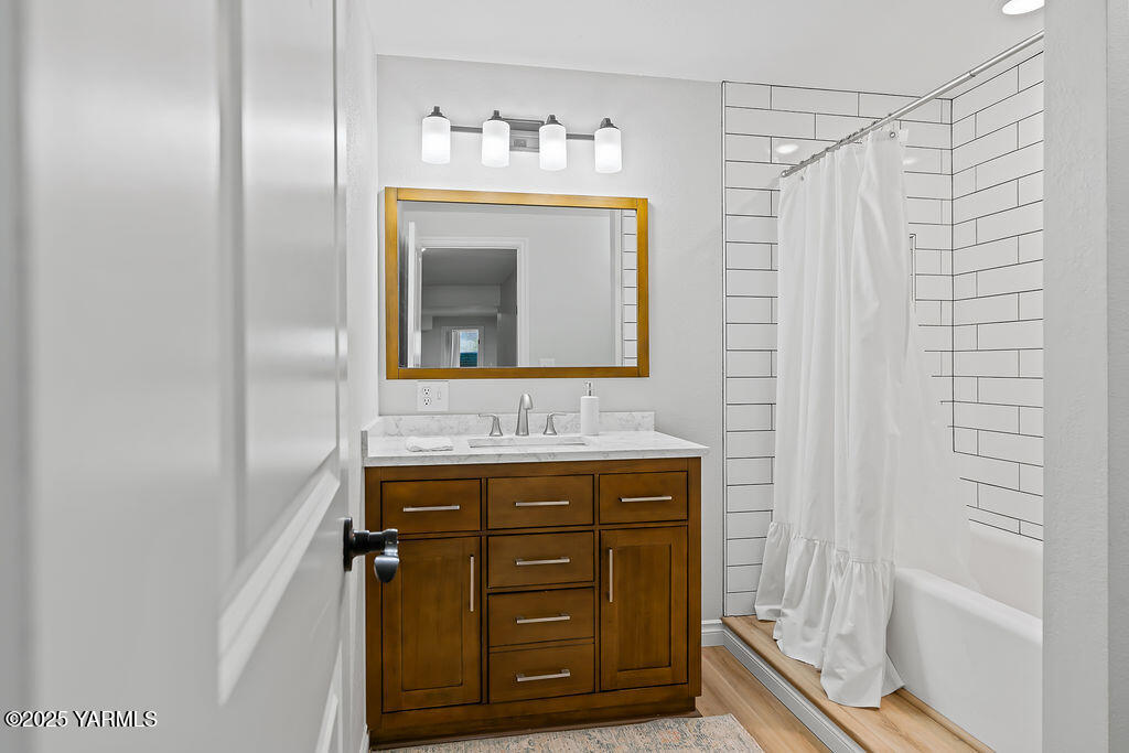 11809 Occidental Road Yakima, WA 98908 - Photo 46 of 60 a bathroom with a sink and a mirror