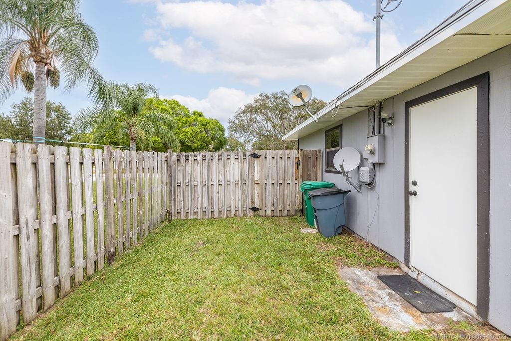 6803 Salerno Road Fort Pierce, FL 34951 - Photo 17 of 65 a view of a backyard