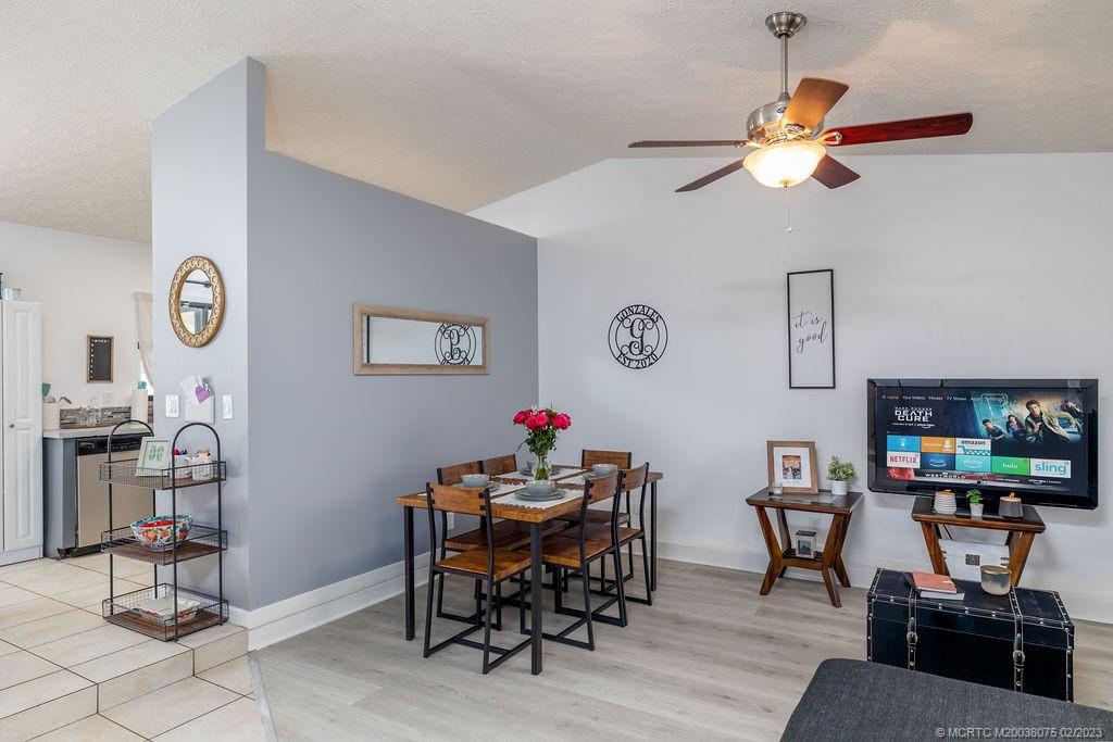 6803 Salerno Road Fort Pierce, FL 34951 - Photo 22 of 65 a living room with furniture and a flat screen tv