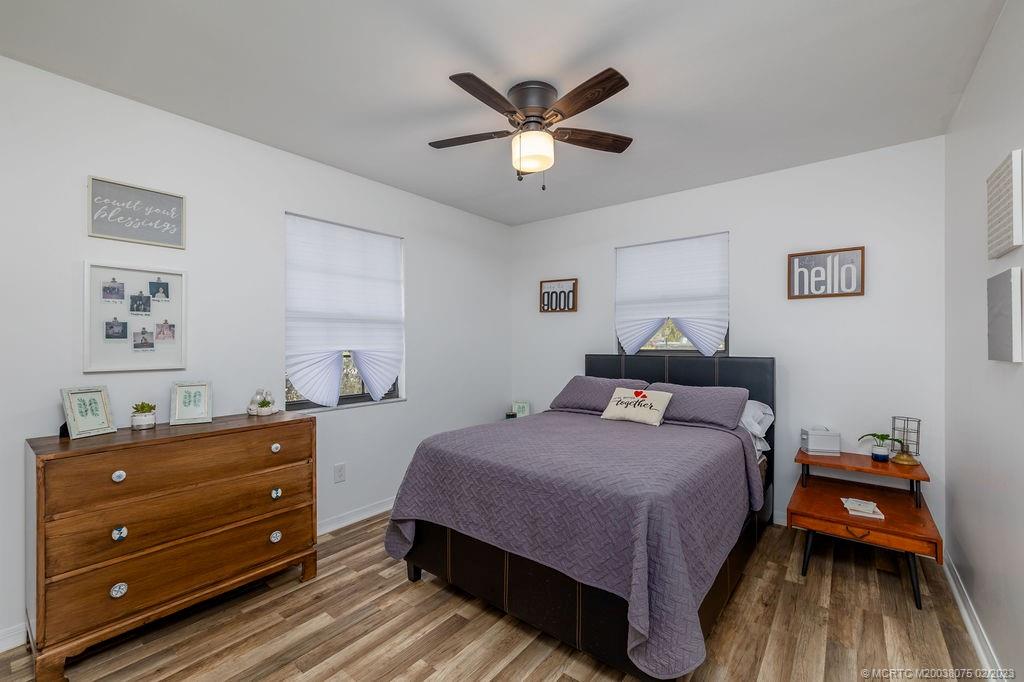 6803 Salerno Road Fort Pierce, FL 34951 - Photo 40 of 65 a bedroom with a bed and a dresser
