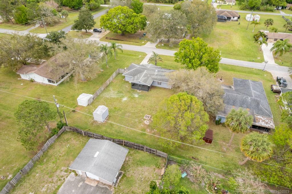 6803 Salerno Road Fort Pierce, FL 34951 - Photo 49 of 65 a view of a swimming pool with a yard