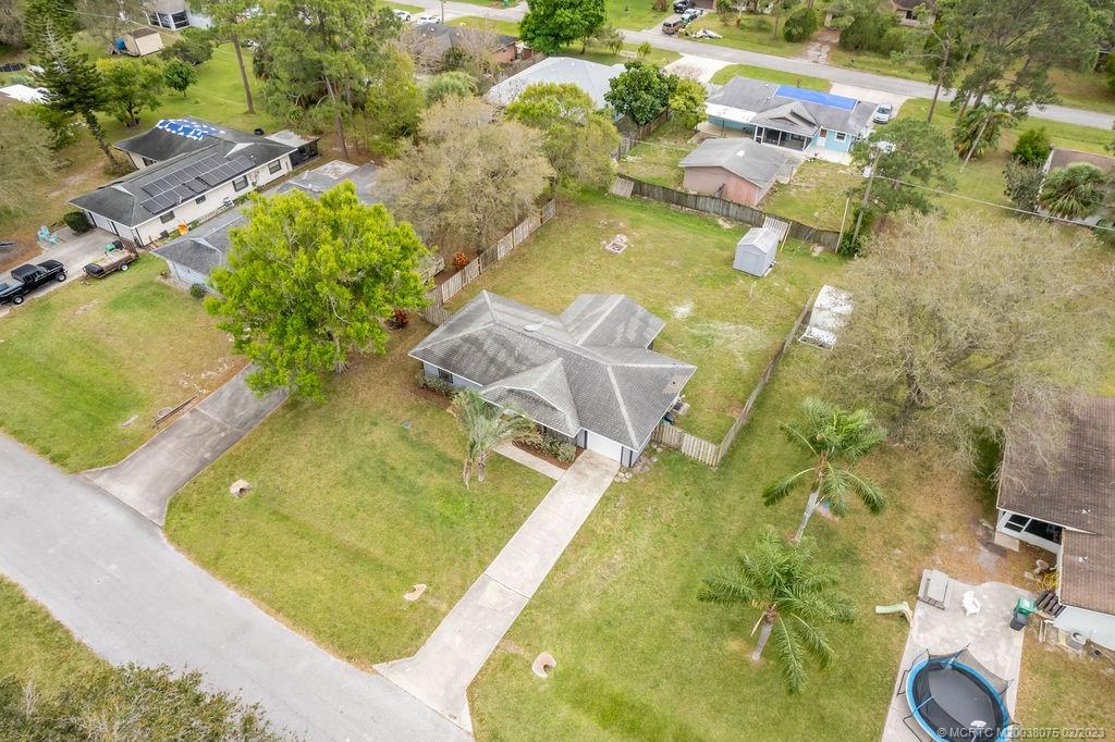 6803 Salerno Road Fort Pierce, FL 34951 - Photo 53 of 65 an aerial view of residential houses with outdoor space