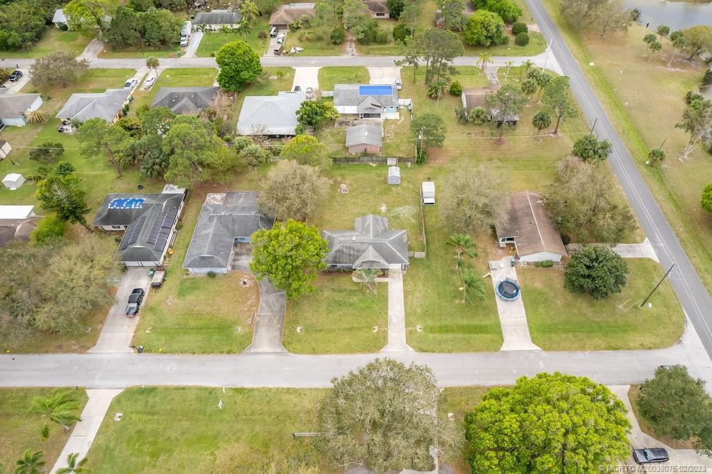 6803 Salerno Road Fort Pierce, FL 34951 - Photo 55 of 65 an aerial view of residential houses with yard
