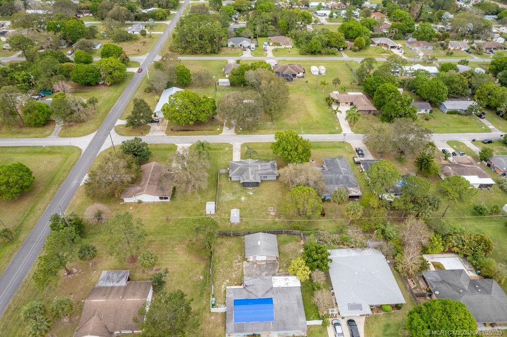 6803 Salerno Road Fort Pierce, FL 34951 - Photo 59 of 65 an aerial view of residential houses with yard