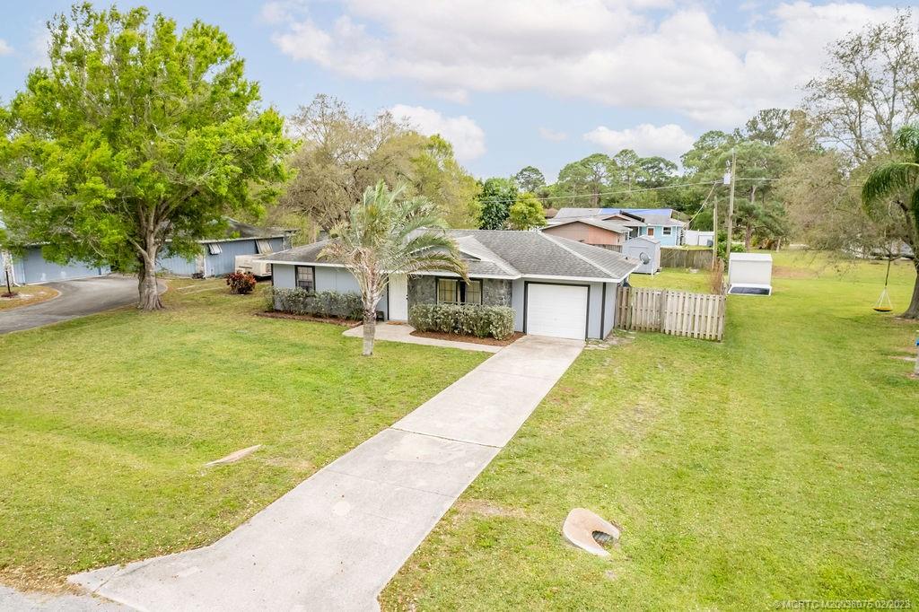 6803 Salerno Road Fort Pierce, FL 34951 - Photo 65 of 65 a view of a house with swimming pool and sitting area