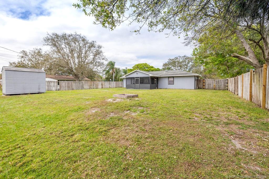 6803 Salerno Road Fort Pierce, FL 34951 - Photo 8 of 65 a view of a house with a yard and sitting area