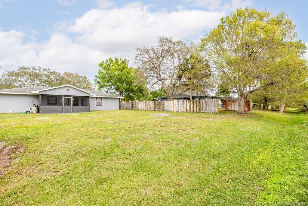 6803 Salerno Road Fort Pierce, FL 34951 - Photo 10 of 65 a house view with swimming pool in front of it