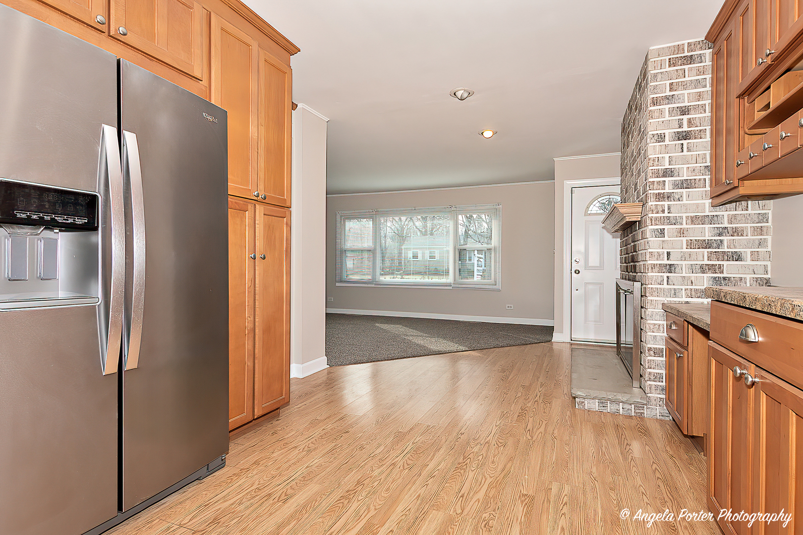 238 Woodland Road Libertyville, IL 60048 - Photo 7 of 19 a view of kitchen with stainless steel appliances wooden floor and a window