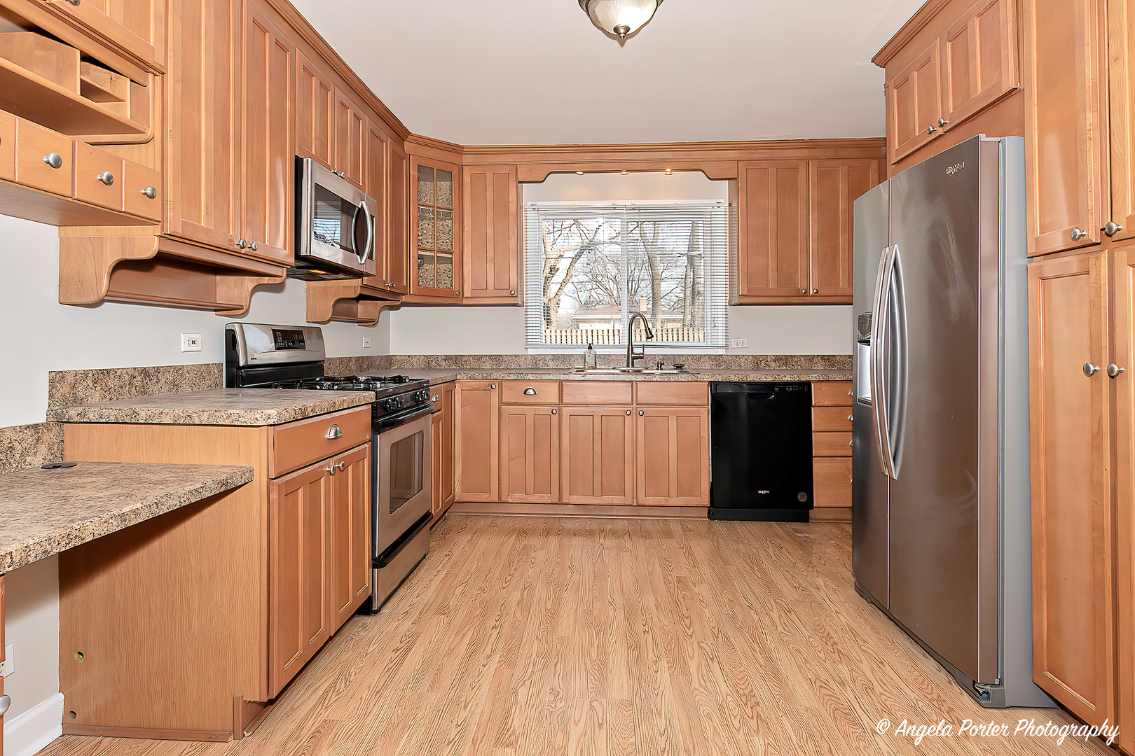 238 Woodland Road Libertyville, IL 60048 - Photo 10 of 19 a kitchen with stainless steel appliances granite countertop a stove a sink dishwasher and a refrigerator