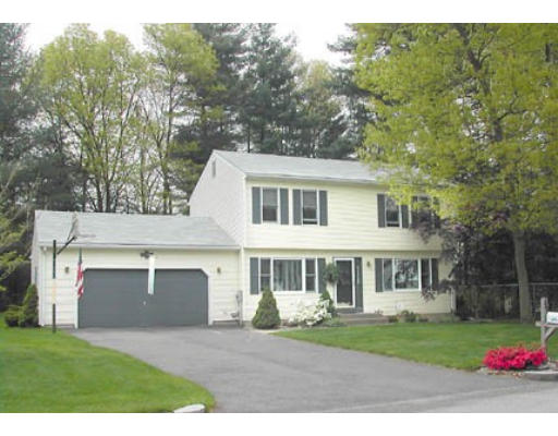 65 Brianna Lane Springfield, MA 01129 - Photo 1 of 1 a front view of a house with a yard and garage