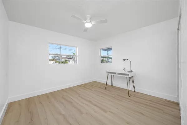 a view of a lake with houses in the back