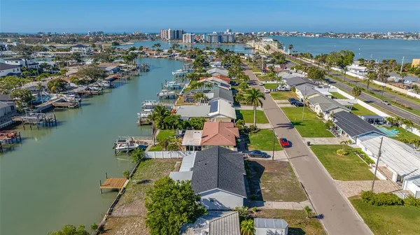 a aerial view of a house with garden space and lake view