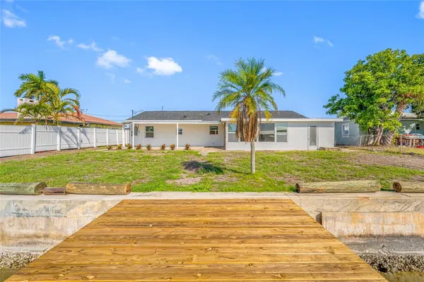 a front view of house with yard having outdoor seating