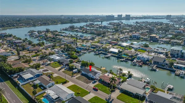 a view of a swimming pool and outdoor seating
