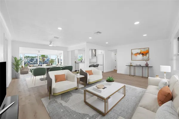a view of a kitchen with a sink a refrigerator and a window