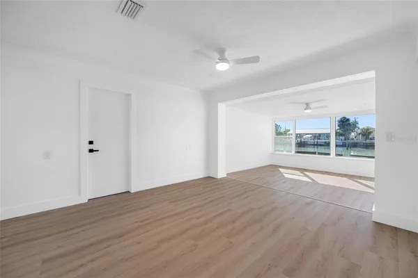 a view of a kitchen with wooden floor