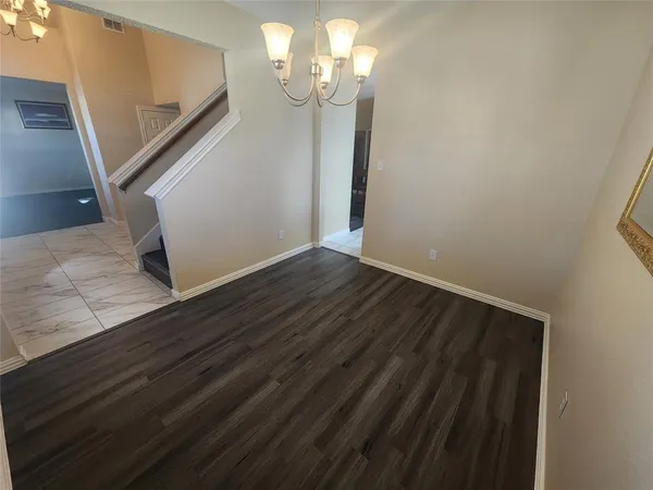 a view of a livingroom with wooden floor