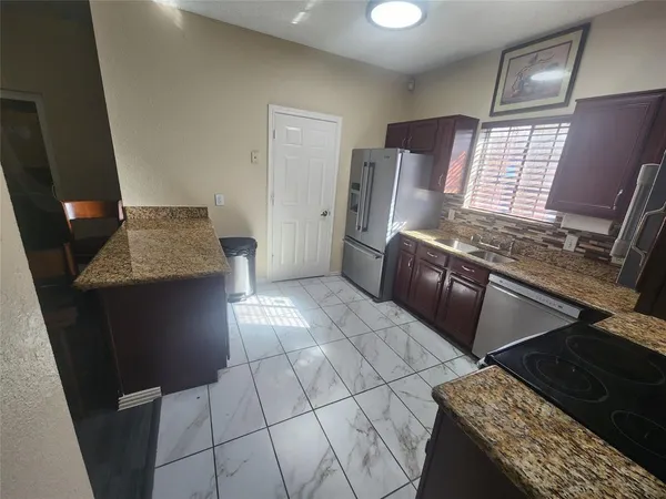a view of a kitchen with cabinets