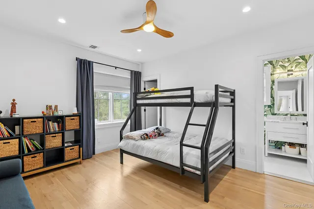 a bedroom with furniture and a window