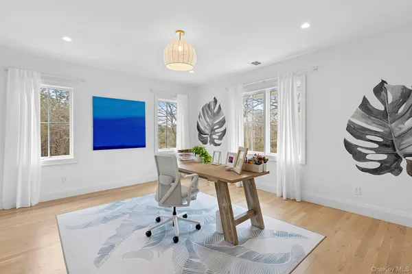 a living room with furniture a window and a table