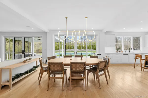 a view of a dining room with furniture window and wooden floor