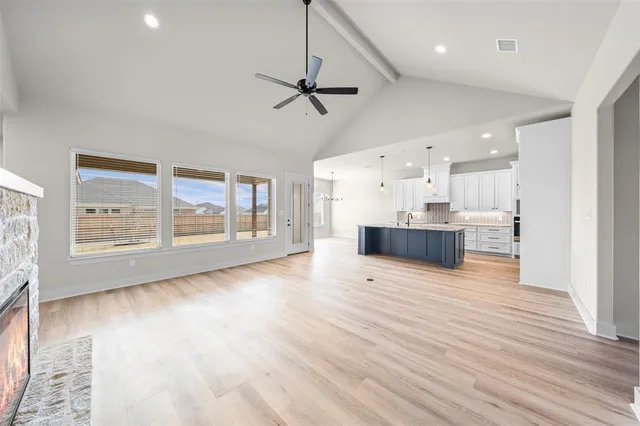 a view of kitchen with furniture and wooden floor