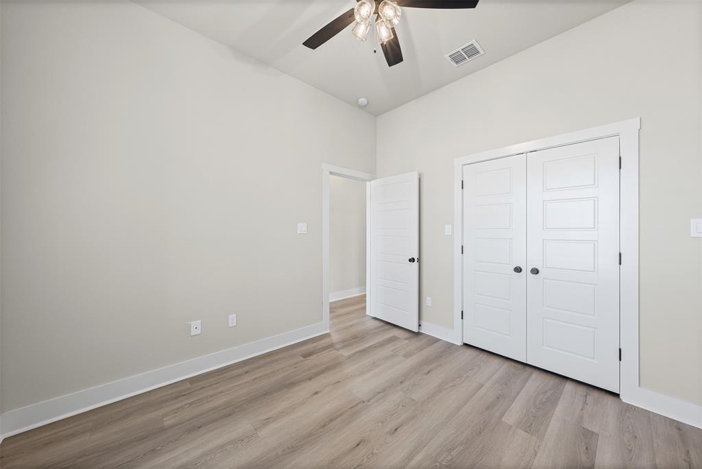 900 Day Star Drive Hewitt, TX 76643 - Photo 27 of 40 Unfurnished bedroom with light wood-type flooring, a ceiling fan, and a closet
