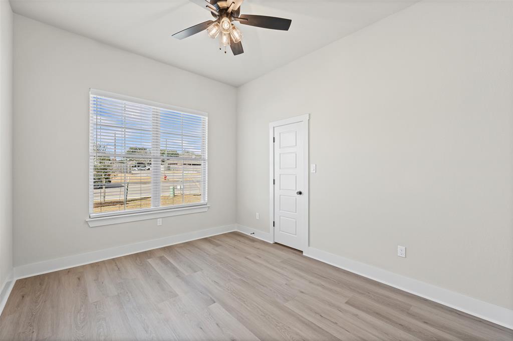 900 Day Star Drive Hewitt, TX 76643 - Photo 28 of 40 Unfurnished room with light wood-style flooring and ceiling fan