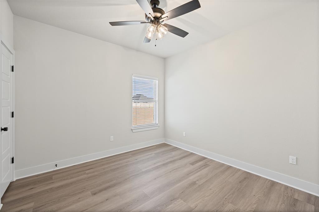 900 Day Star Drive Hewitt, TX 76643 - Photo 30 of 40 Empty room with light wood-style flooring and a ceiling fan