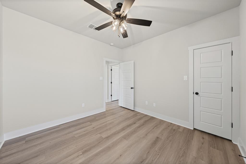 900 Day Star Drive Hewitt, TX 76643 - Photo 31 of 40 Unfurnished bedroom with light wood finished floors and ceiling fan