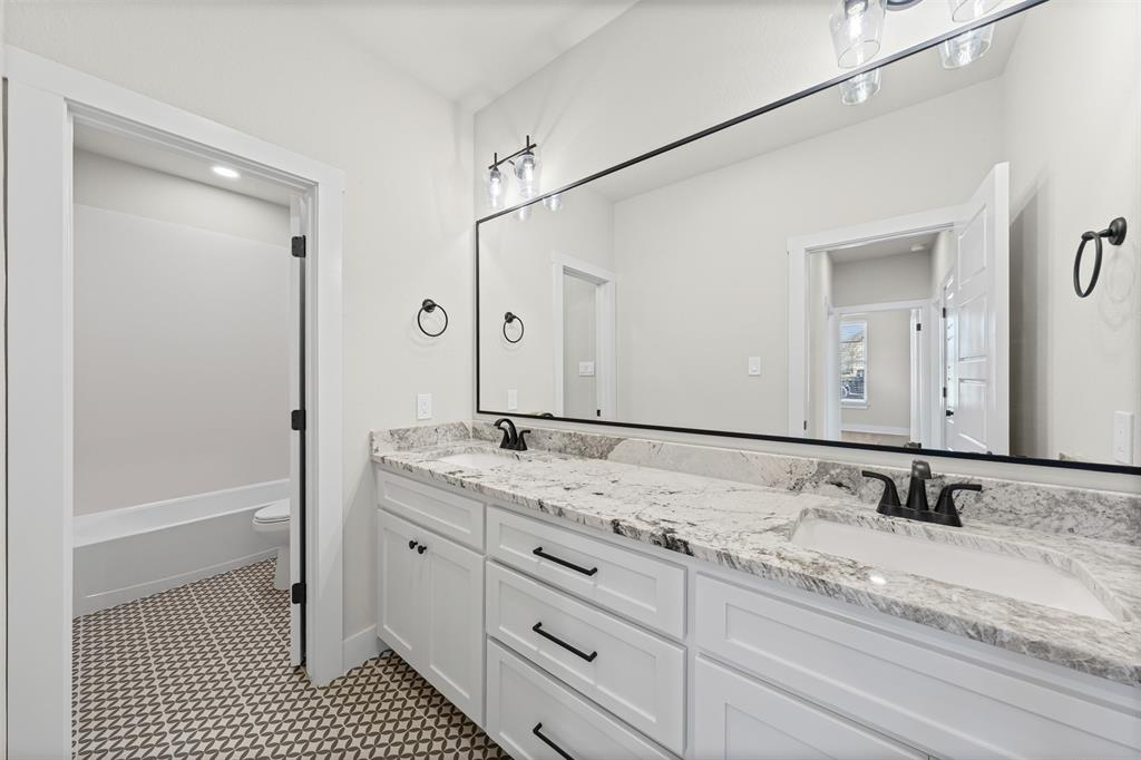900 Day Star Drive Hewitt, TX 76643 - Photo 32 of 40 Full bathroom featuring double vanity and toilet