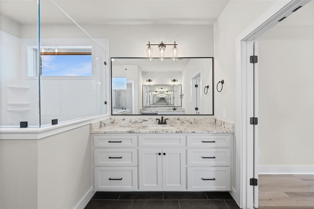 900 Day Star Drive Hewitt, TX 76643 - Photo 37 of 40 Full bath featuring vanity and dark tile patterned flooring