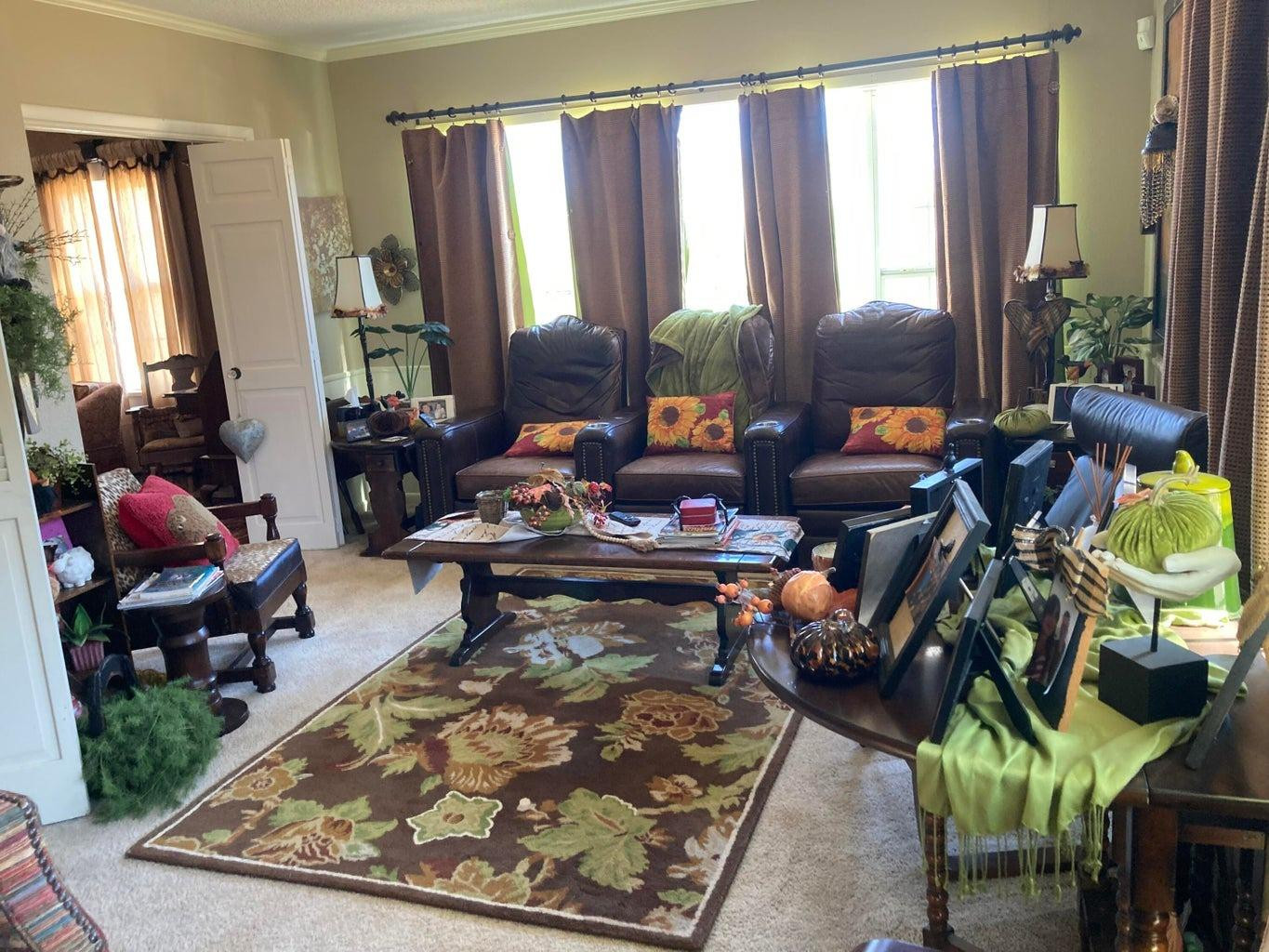 715 Denver Plainview, TX 79072 - Photo 13 of 45 a living room filled with furniture and a floor to ceiling window