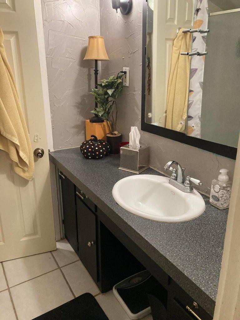715 Denver Plainview, TX 79072 - Photo 30 of 45 a bathroom with a sink and a mirror