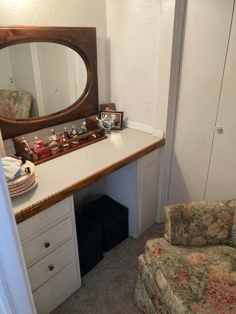 715 Denver Plainview, TX 79072 - Photo 34 of 45 a bedroom with a sink and a mirror