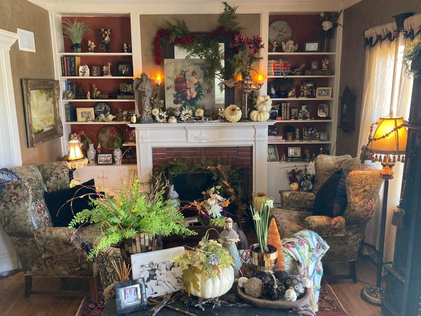 715 Denver Plainview, TX 79072 - Photo 8 of 45 a living room with furniture a bookshelf and a fireplace
