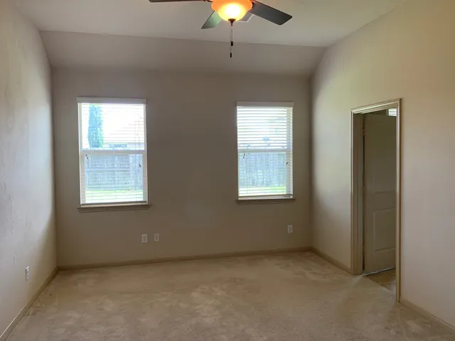 a view of an empty room with a window