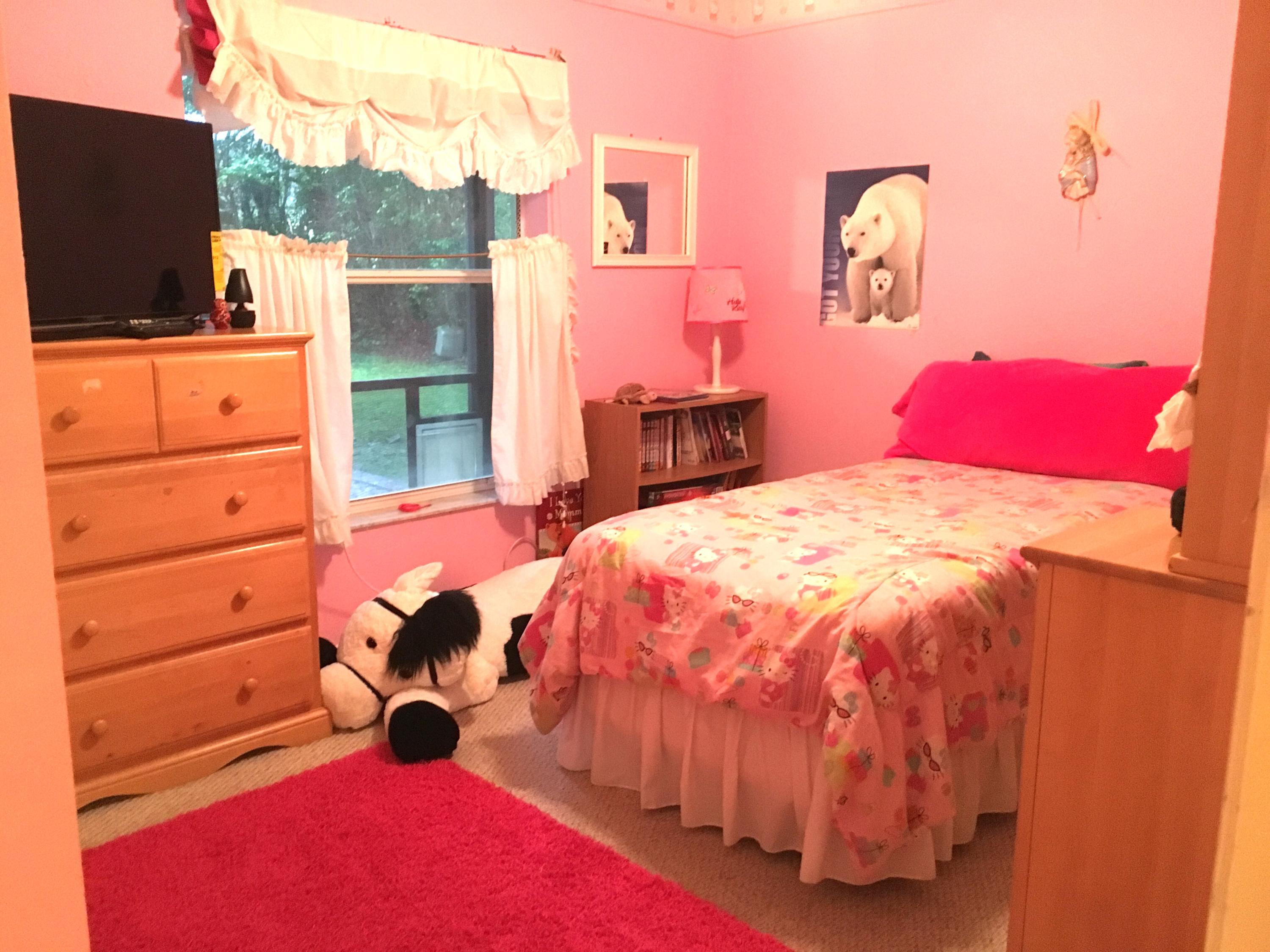 22146 Candle Court Boca Raton, FL 33428 - Photo 12 of 24 a bed sitting in a bedroom next to a window with flat screen tv and dresser