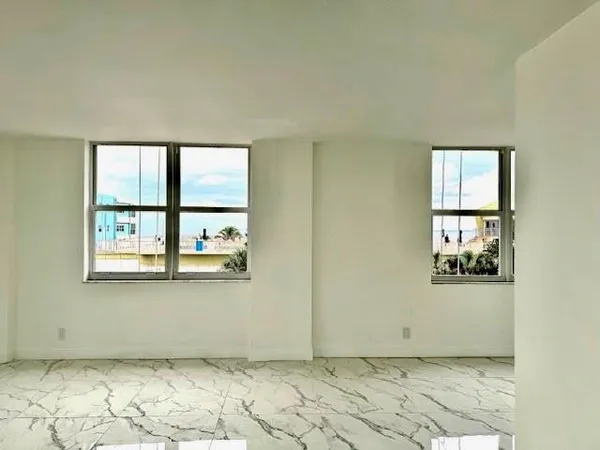 a spacious bathroom with a granite countertop tub sink toilet and shower