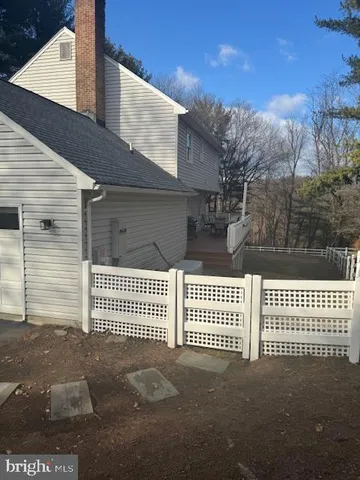 a view of a house with a fence