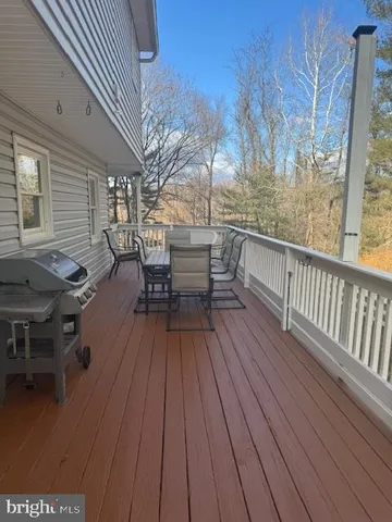 a view of a patio with wooden floor