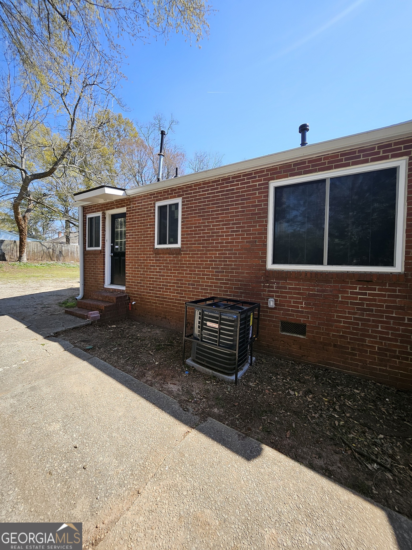 521 Meriwether Street, Unit C Griffin, GA 30224 - Photo 11 of 11 a front view of a house with a yard