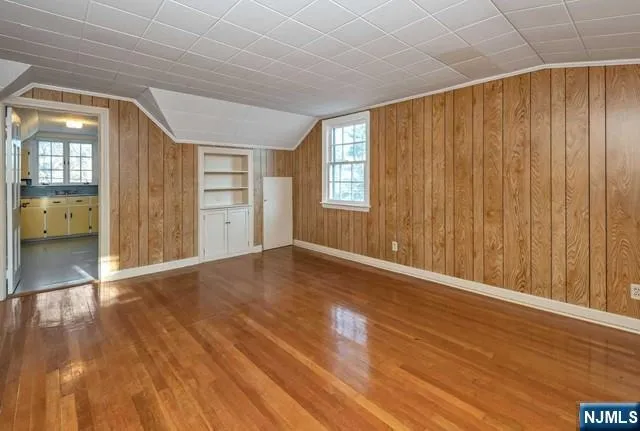 a view of an empty room with glass door