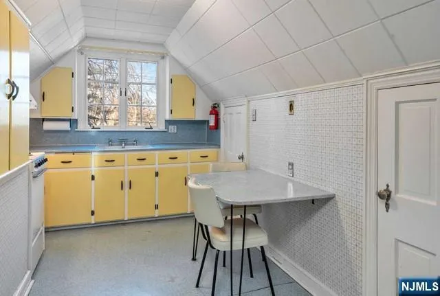 a bathroom with a sink a mirror and a shower