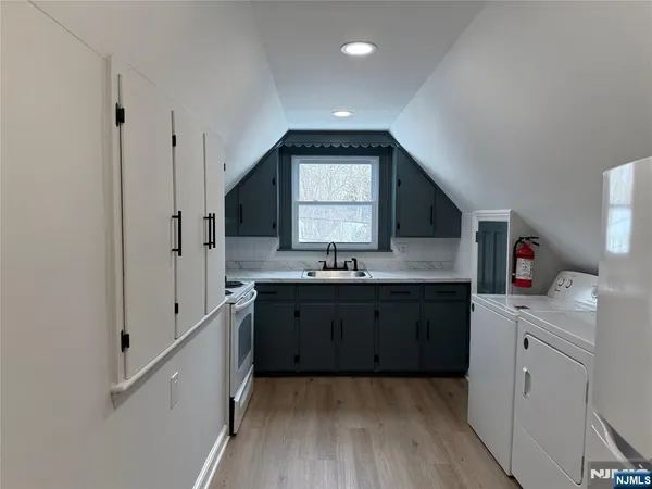 a spacious bathroom with a granite countertop sink mirror and a toilet