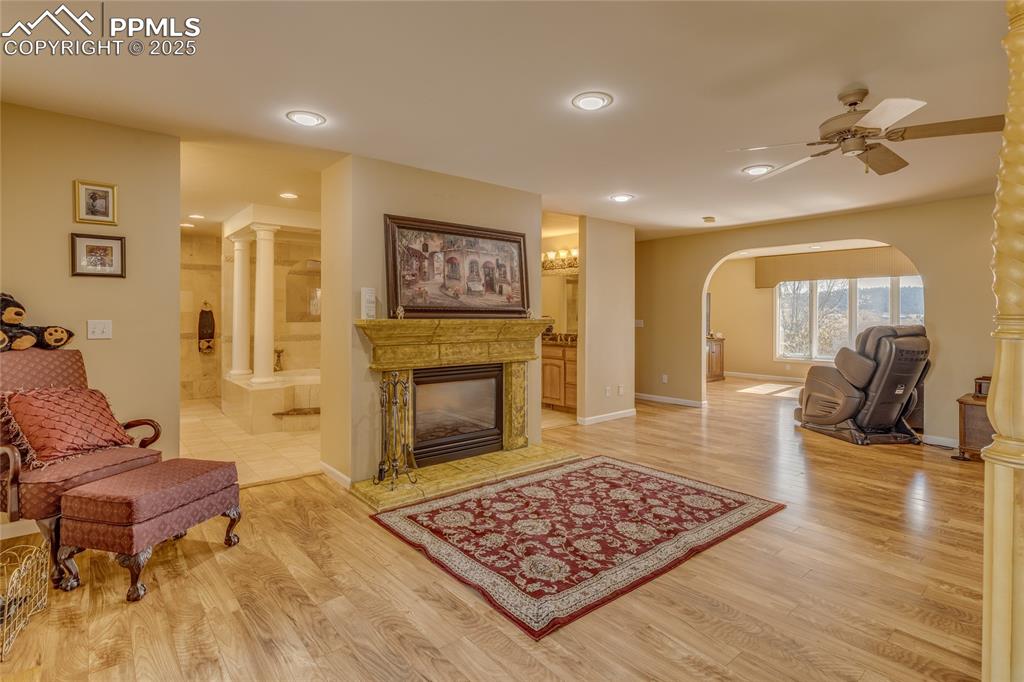 15410 South Perry Park Road Larkspur, CO 80118 - Photo 12 of 28 a living room with furniture and a fireplace