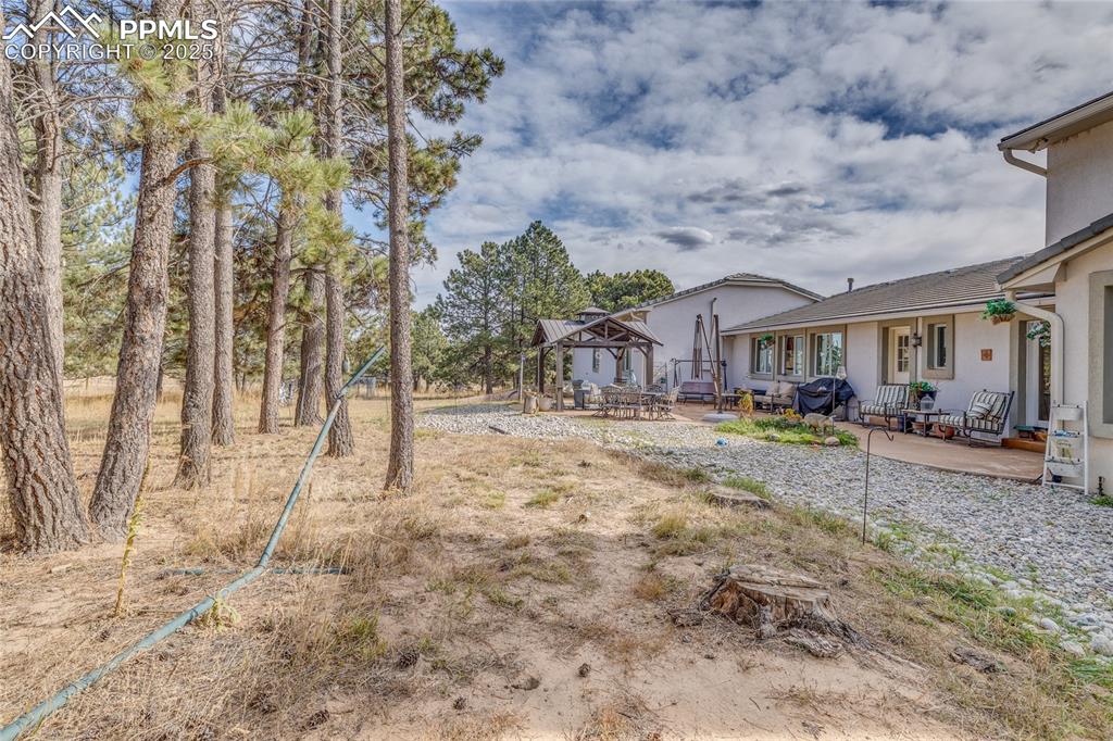15410 South Perry Park Road Larkspur, CO 80118 - Photo 22 of 28 a house view with a outdoor space