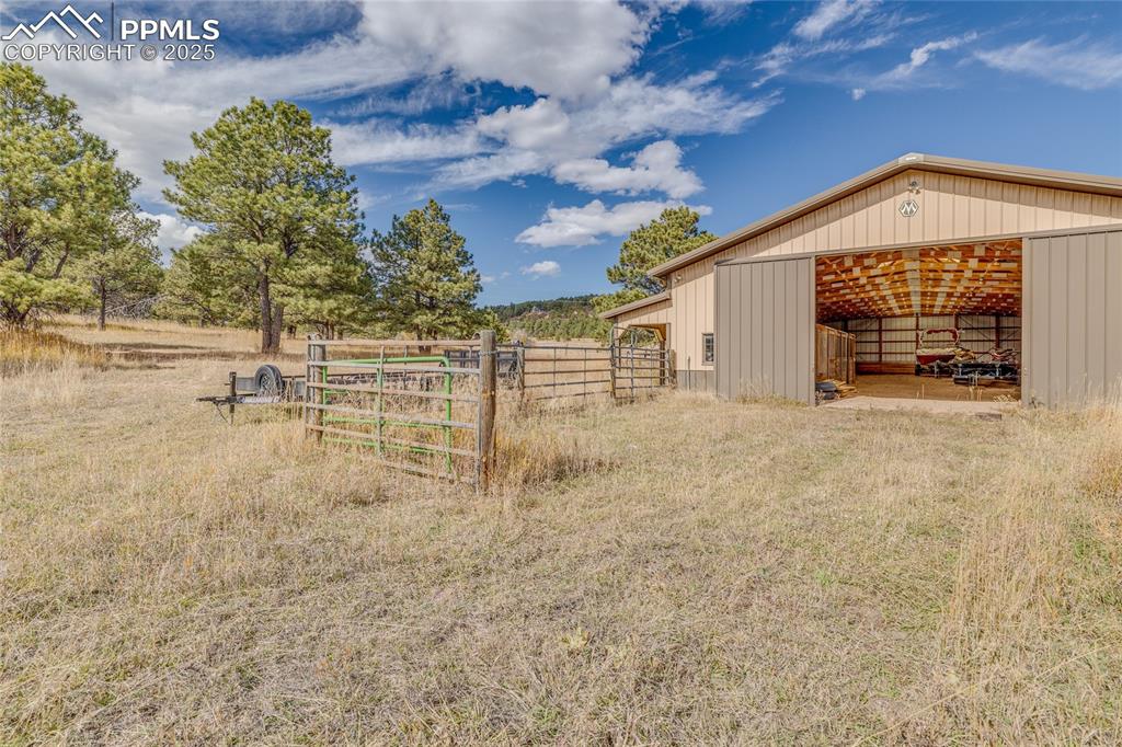 15410 South Perry Park Road Larkspur, CO 80118 - Photo 23 of 28 a view of a house with a outdoor space