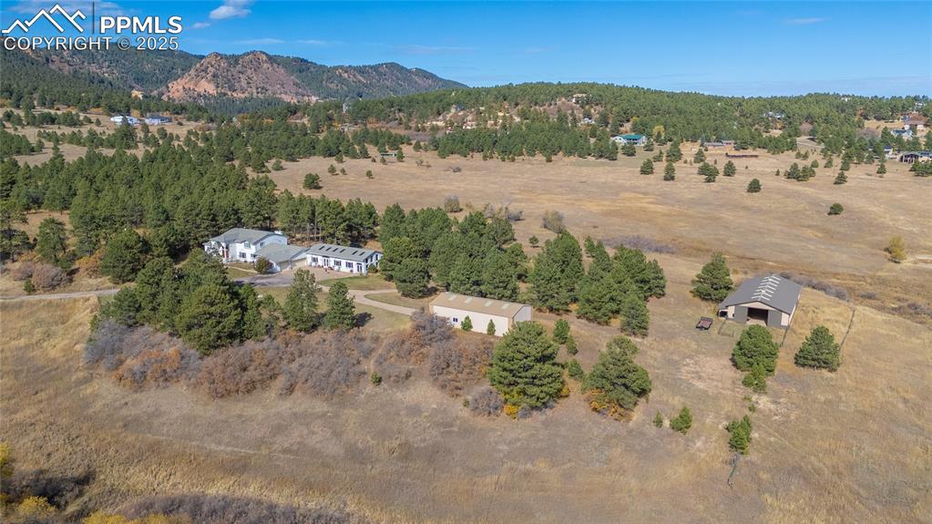 15410 South Perry Park Road Larkspur, CO 80118 - Photo 25 of 28 a view of a town with mountains in the background