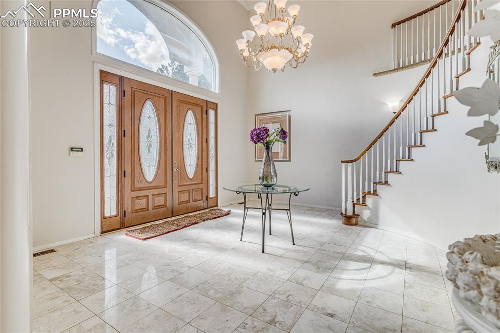 15410 South Perry Park Road Larkspur, CO 80118 - Photo 4 of 28 a view of entryway with livingroom